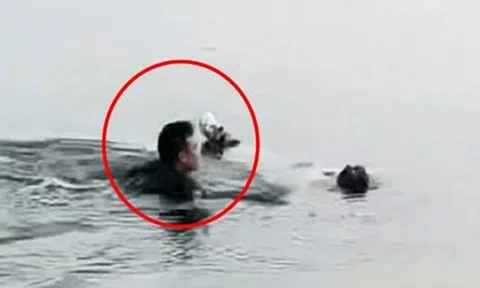 Người bán khoai lang lao xuống hồ nước lạnh cứu phụ nữ suýt chết đuối